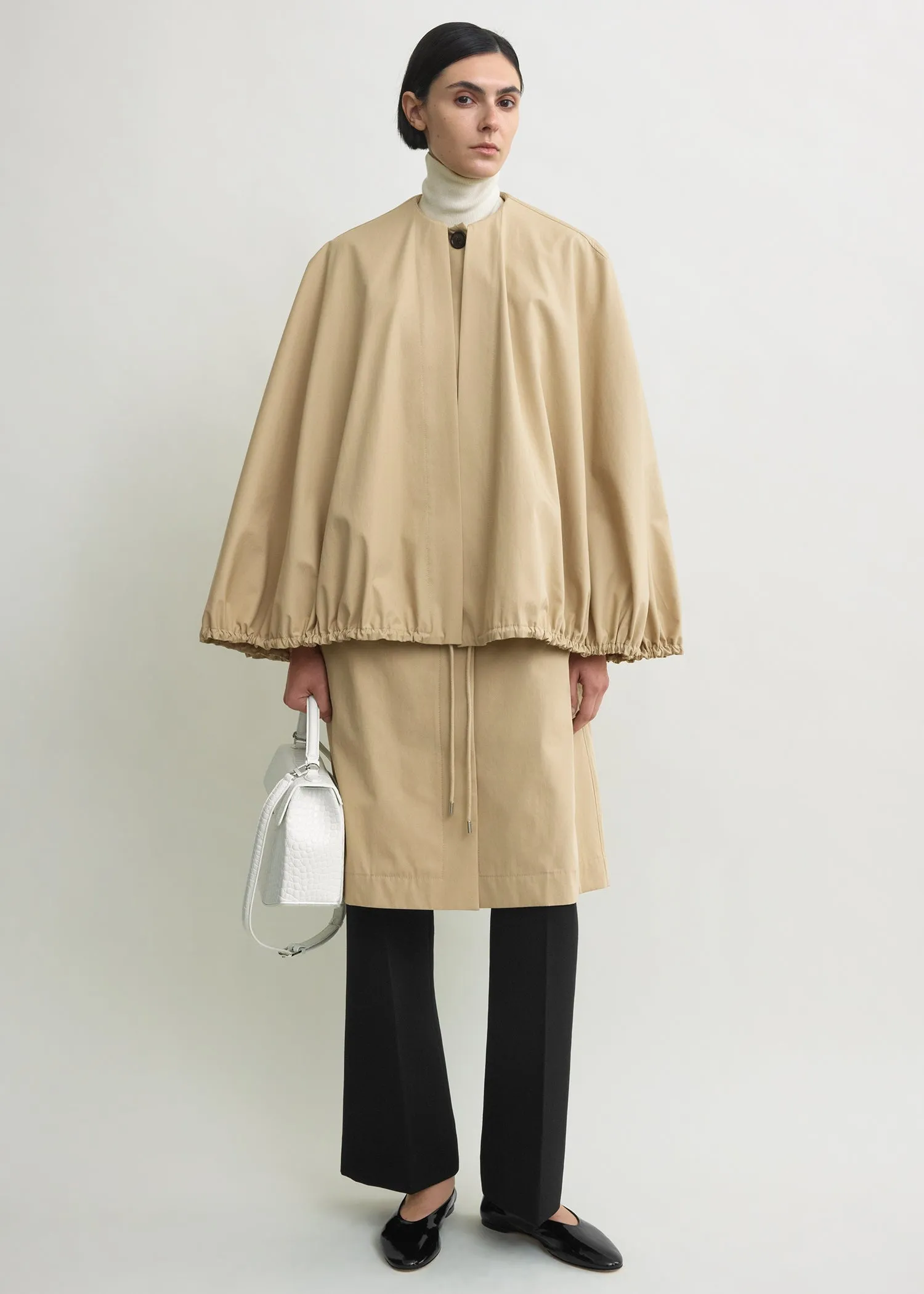 Detachable cape coat beige sold by Toteme