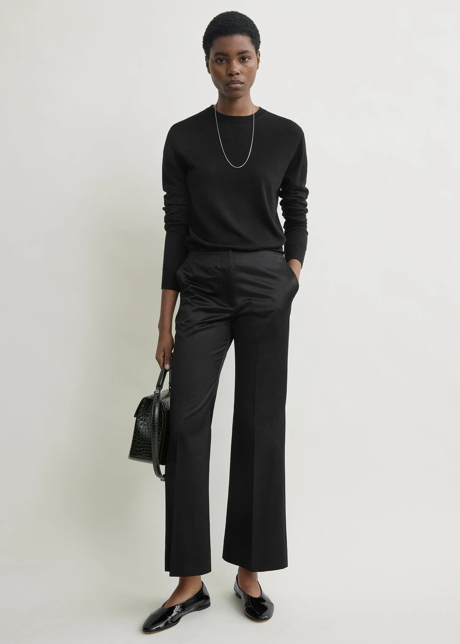 Kick flare raw-edge trousers black sold by Toteme