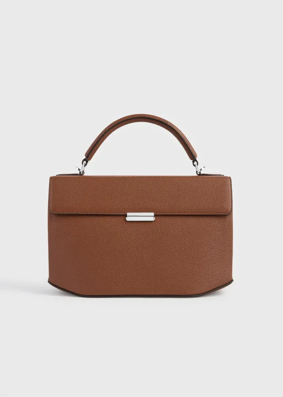 Clip grained-leather top handle sienna made by Toteme