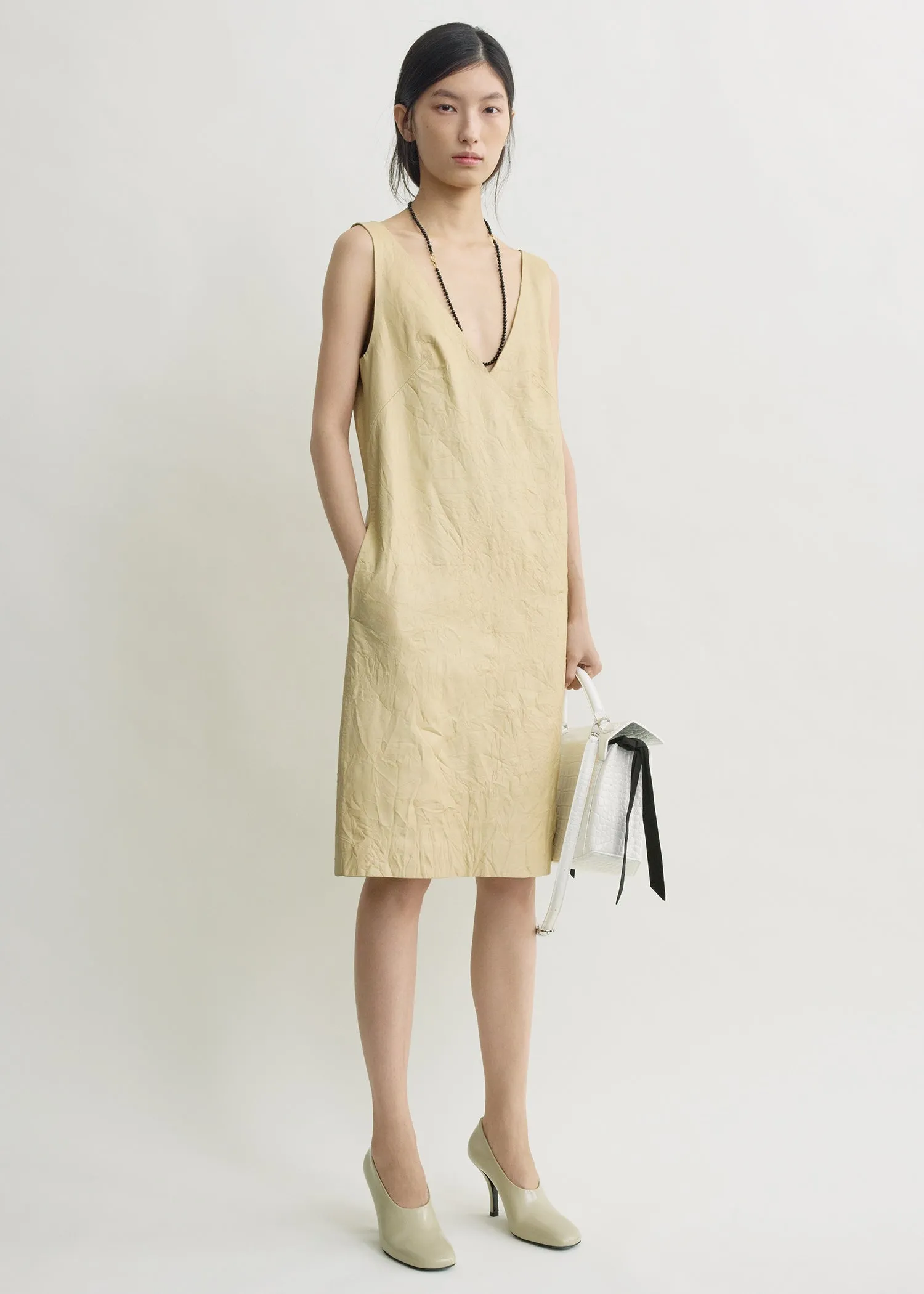 Crinkled leather dress champagne sold by Toteme