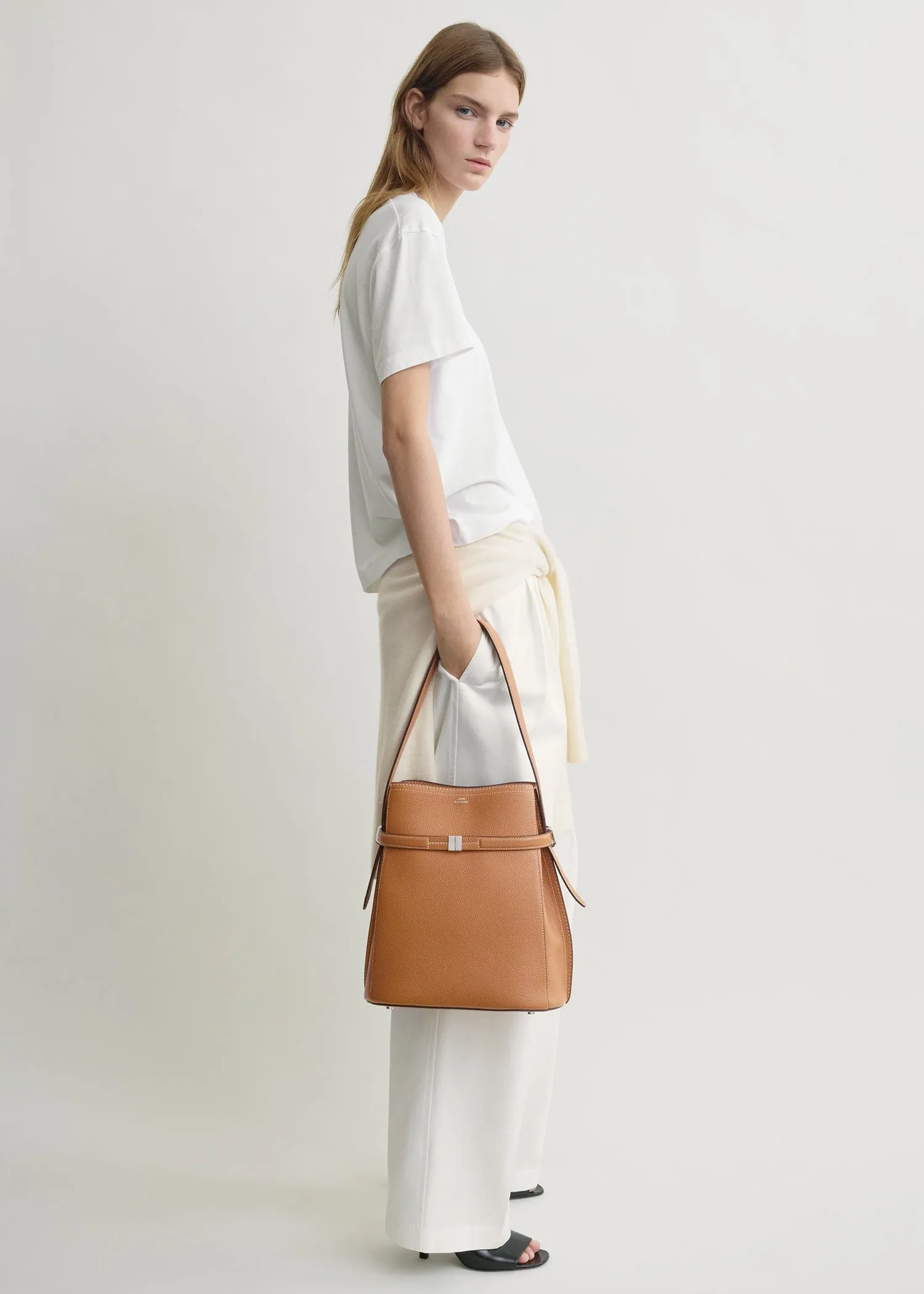 Belted grained-leather bucket bag tan sold by Toteme product image thumbnail 3