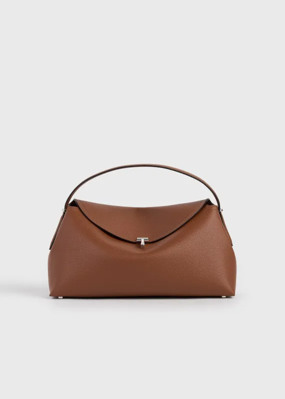 T-lock grained-leather top handle sienna sold by Toteme