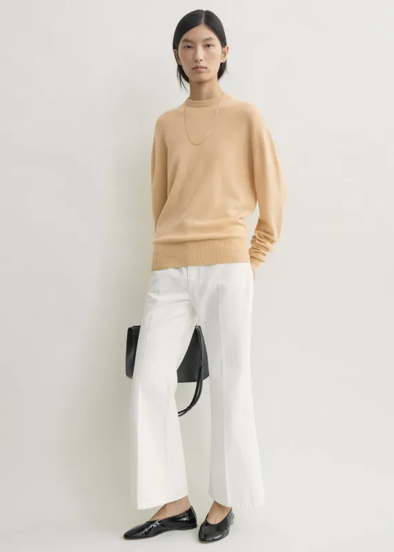 Classic cashmere crew knit pale apricot sold by Toteme
