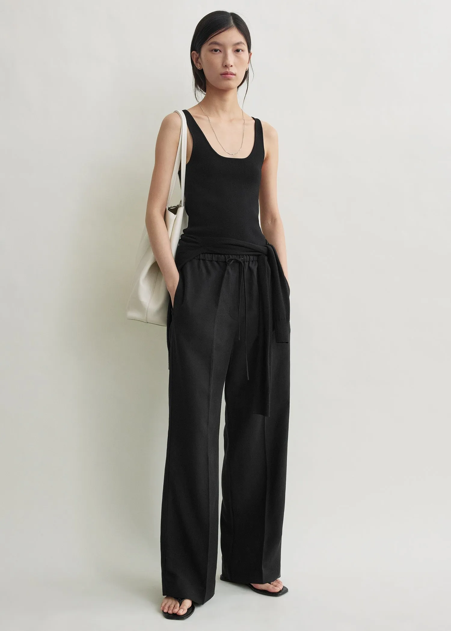 Fluid drawstring trousers black sold by Toteme