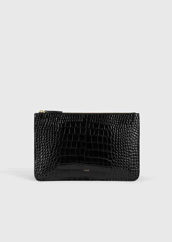 Threefold croco-embossed clutch black made by Toteme