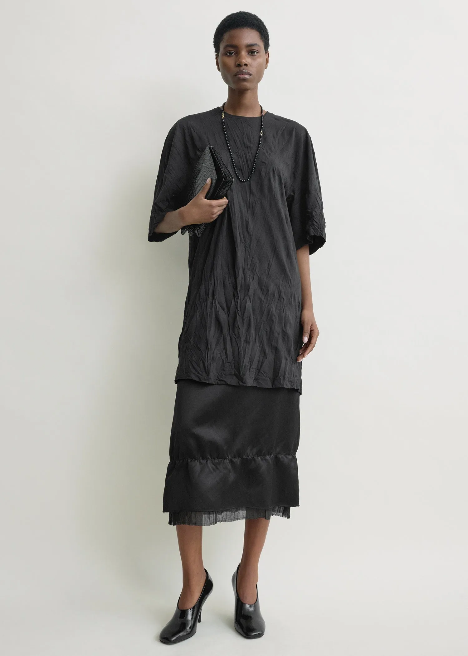 Relaxed tee dress black sold by Toteme