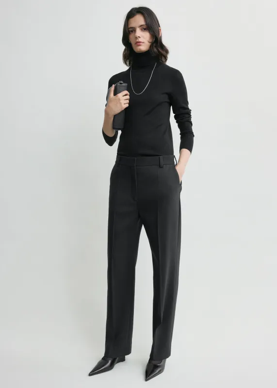 Cropped suit trousers washed black sold by Toteme