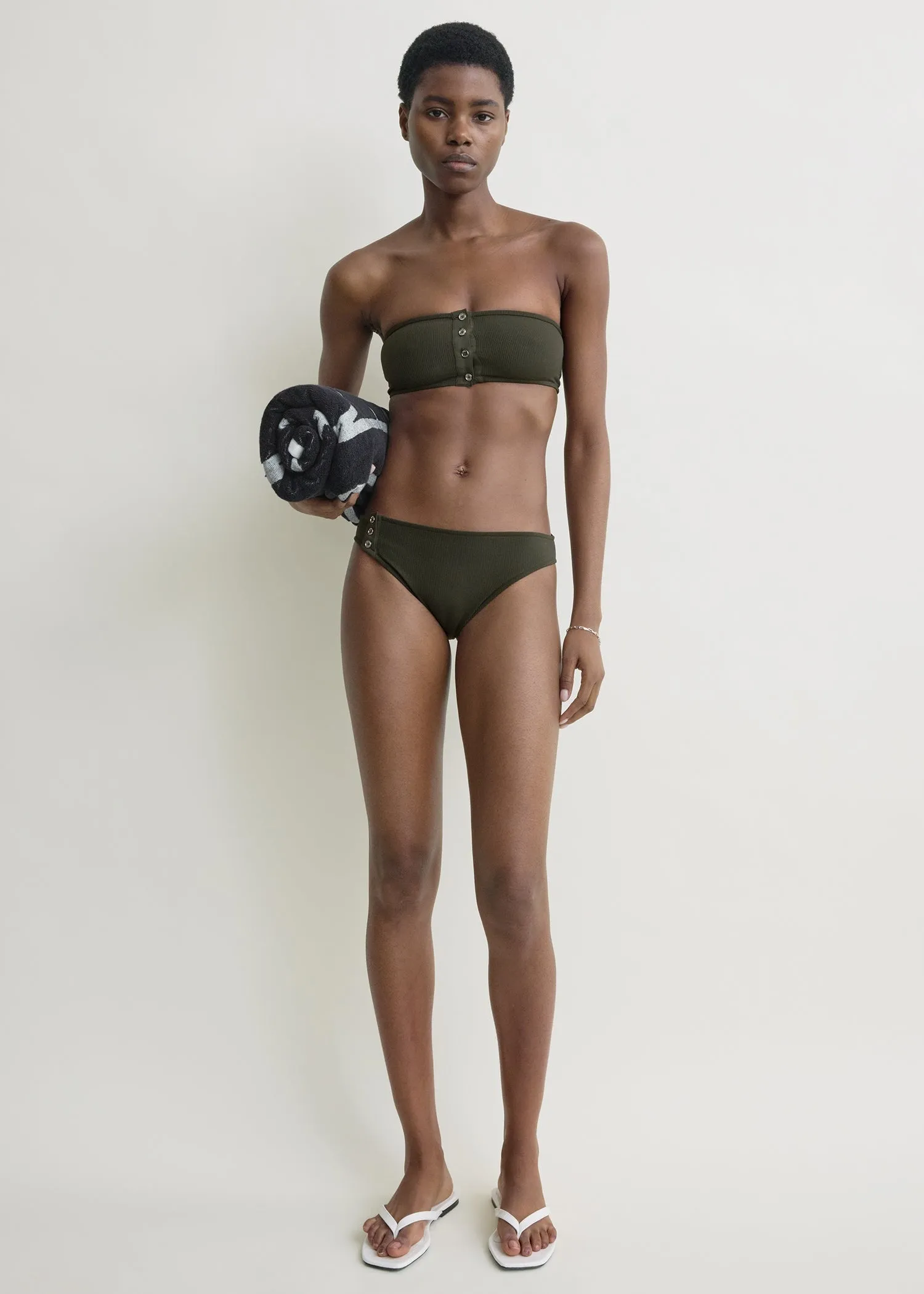 Ribbed strapless bikini top dark green sold by Toteme