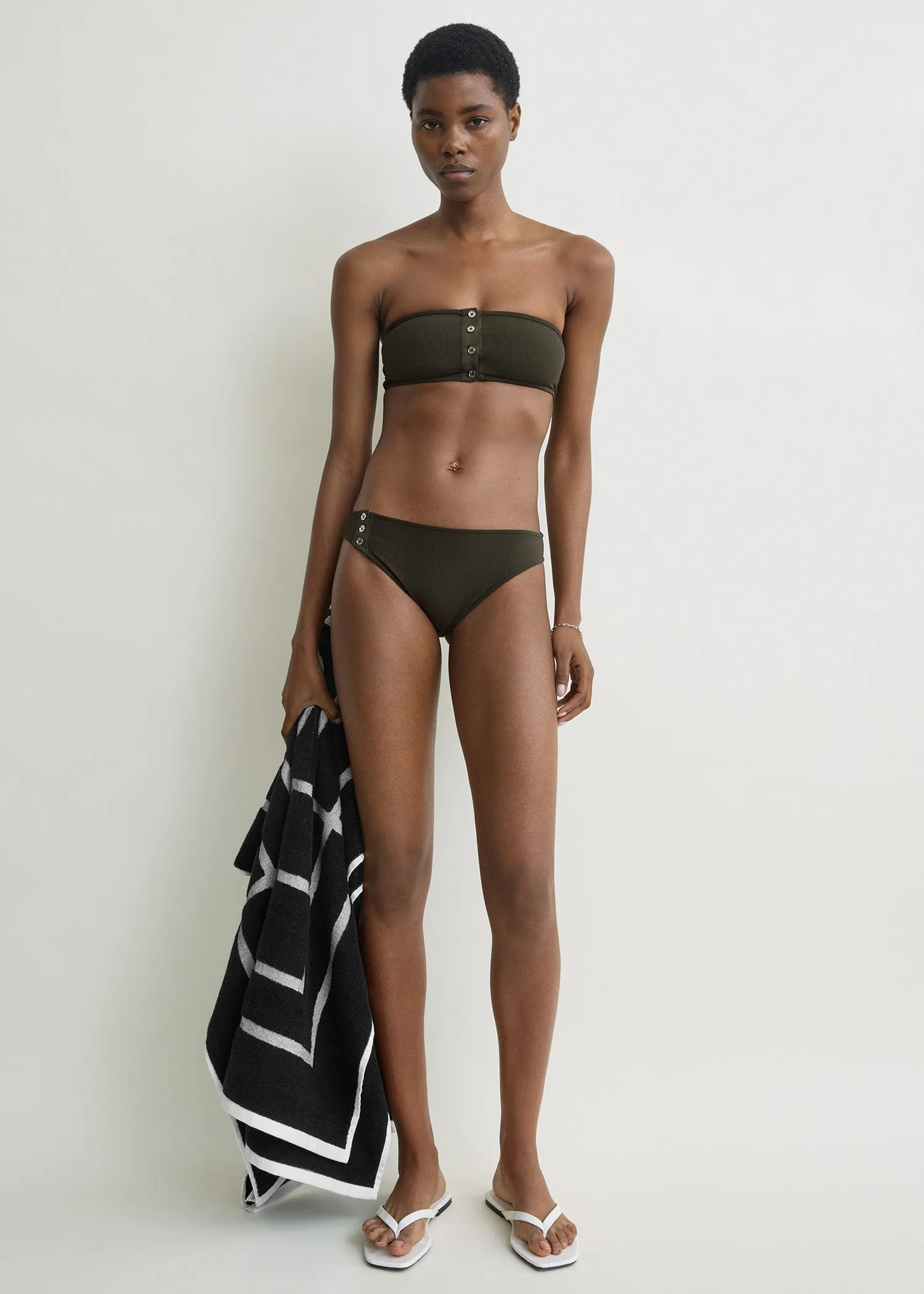 Ribbed bikini bottom dark green sold by Toteme