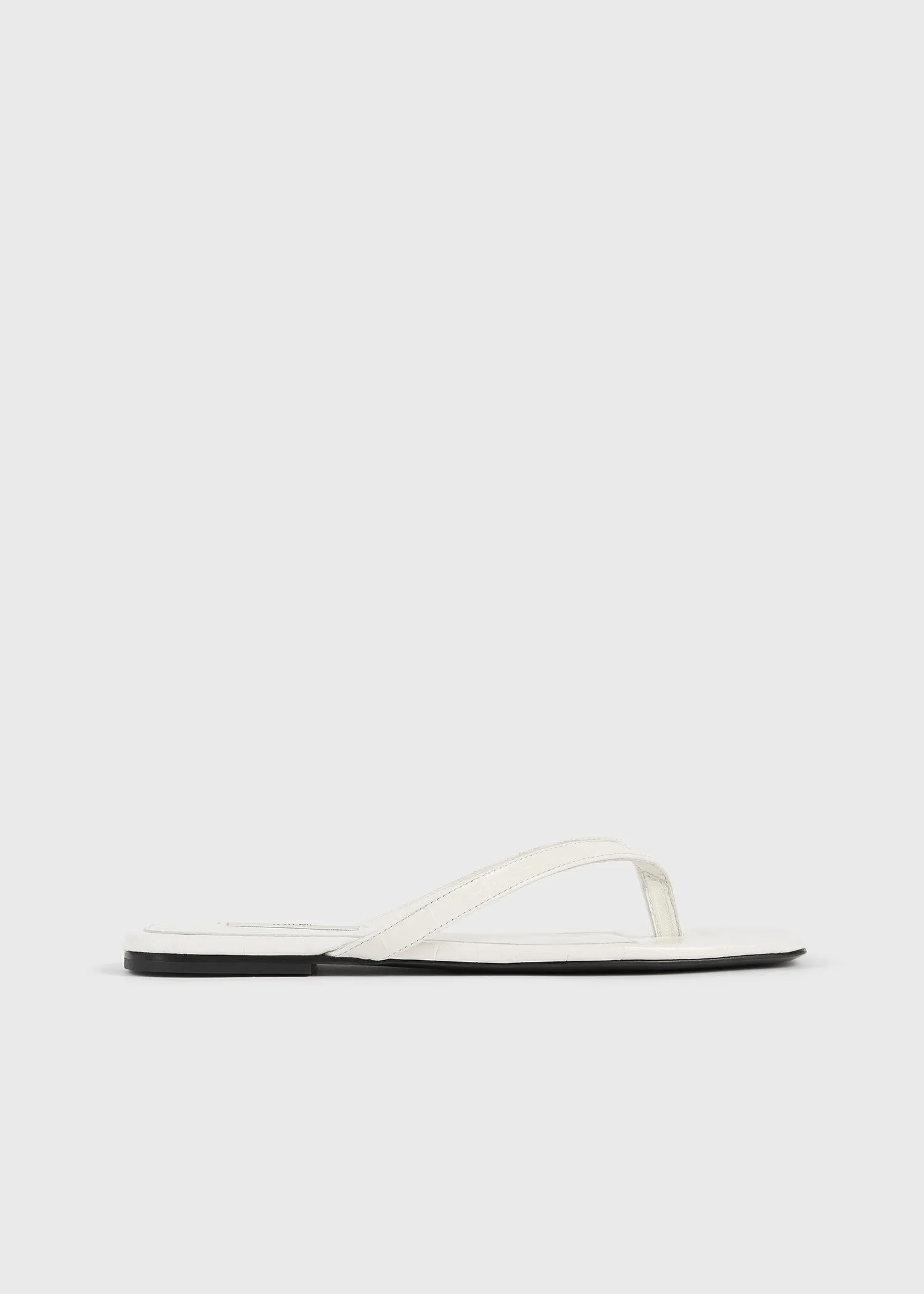 Croco-embossed flip flops off-white sold by Toteme