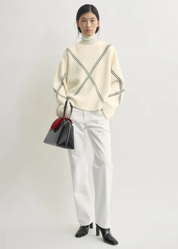 Argyle-stitch cashmere sweater ecru/black made by Toteme