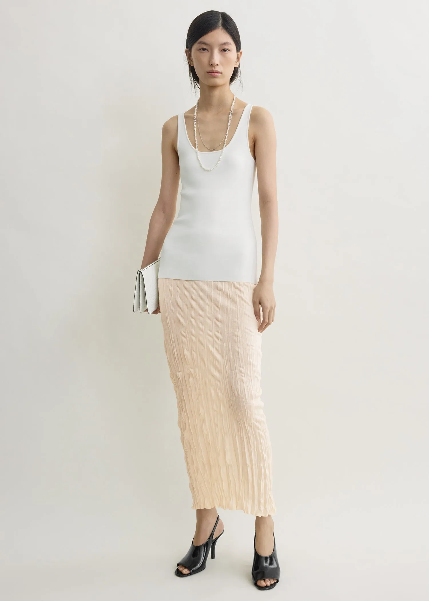 Crinkled knit skirt pale apricot sold by Toteme