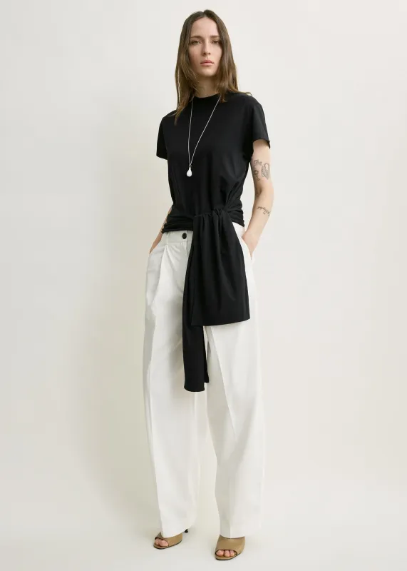 Single pleat cotton trousers white made by Toteme