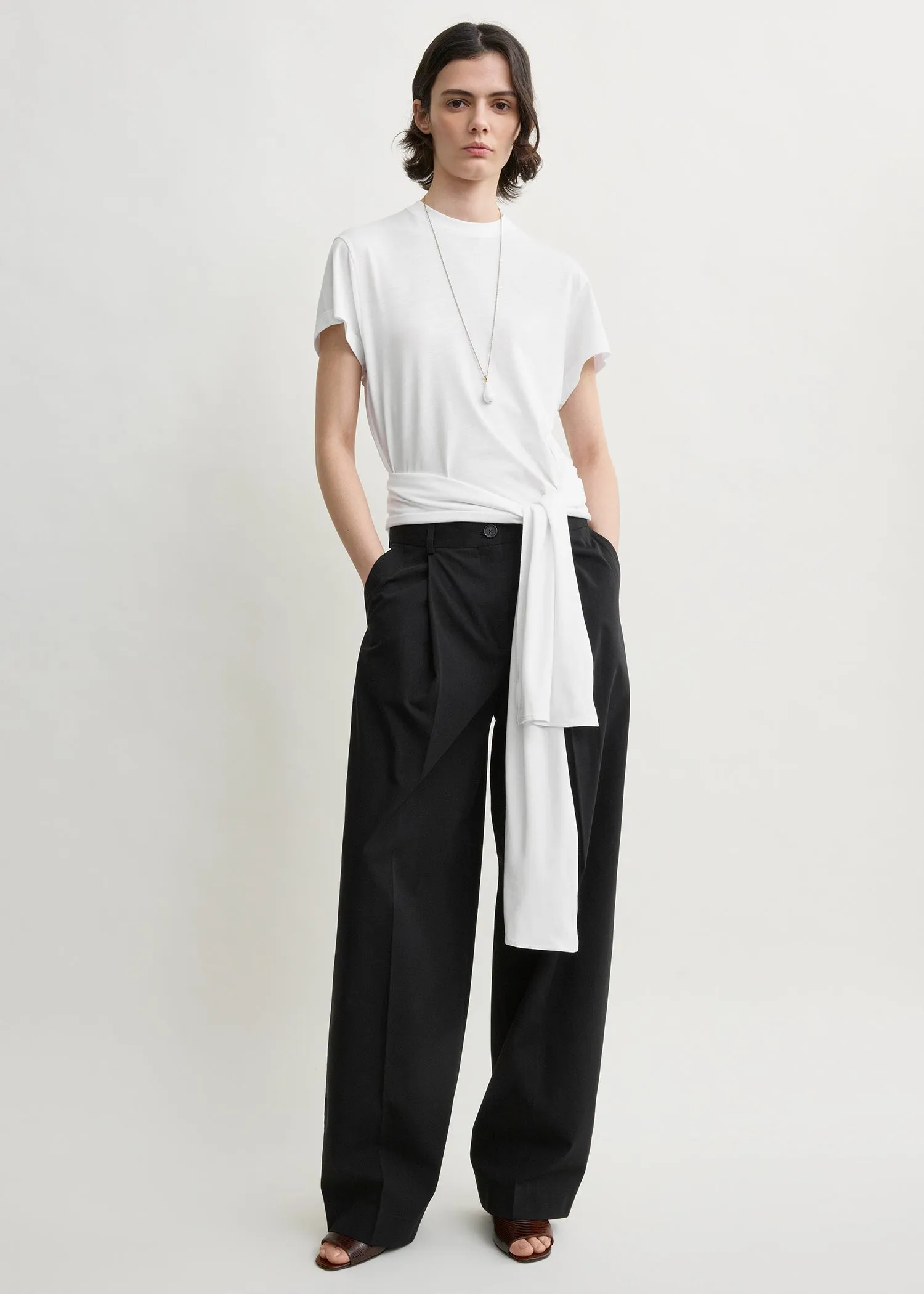 Single pleat cotton trousers black sold by Toteme