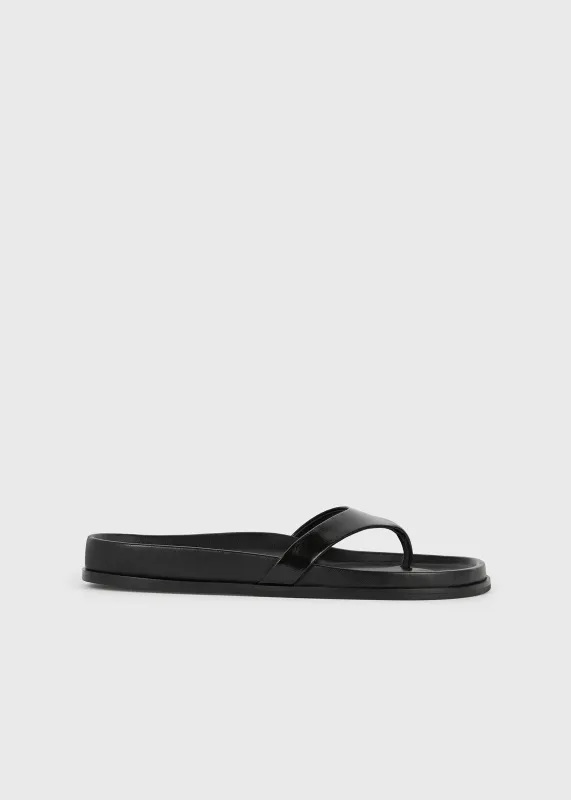 Contoured naplack flip flops black made by Toteme