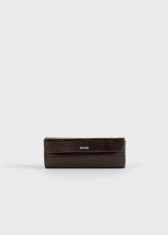 Lizard-embossed lipstick case brown made by Toteme