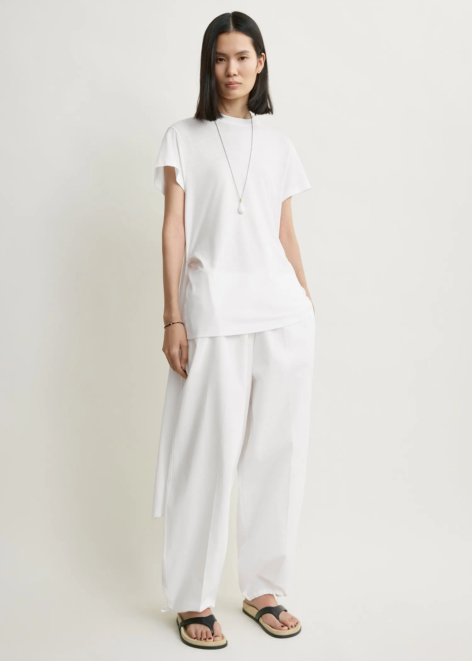 Drawstring cotton trousers white sold by Toteme
