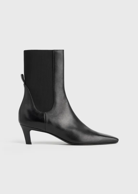 Leather mid-heel boots black made by Toteme