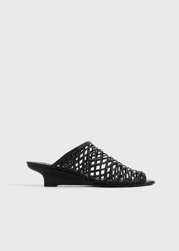 Summer woven mules black made by Toteme
