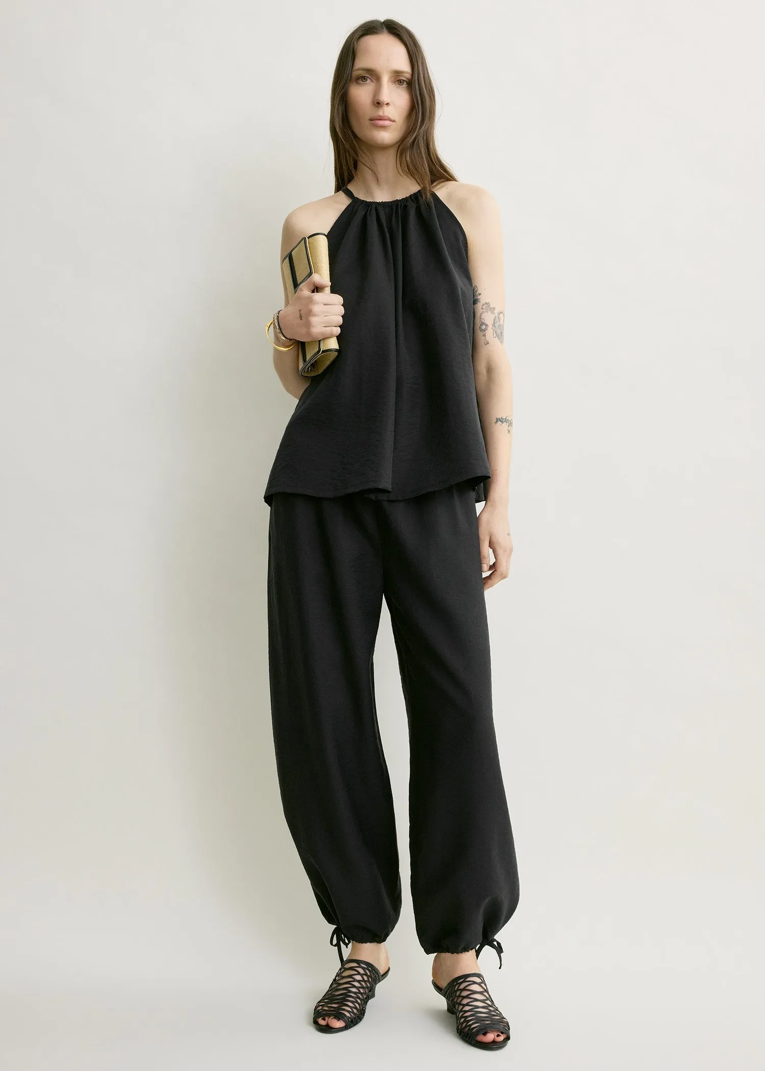 Parachute halter top black sold by Toteme