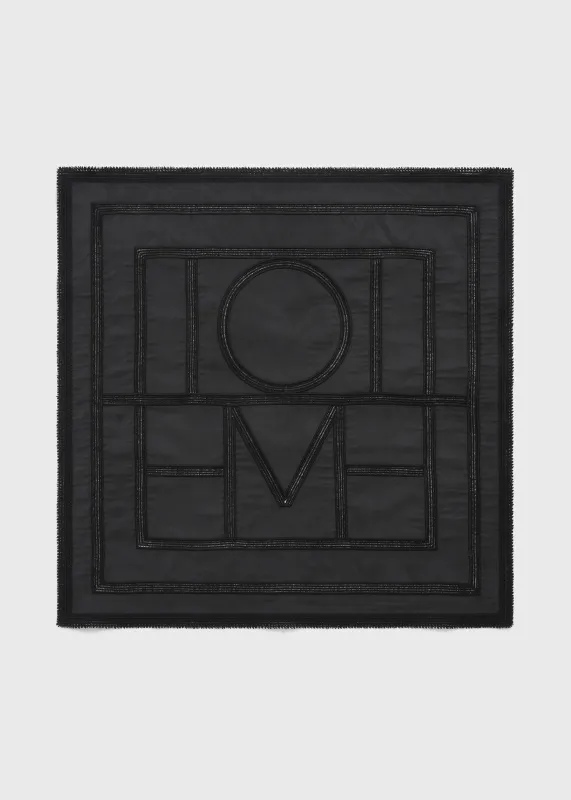 Monogram crochet silk scarf washed black made by Toteme