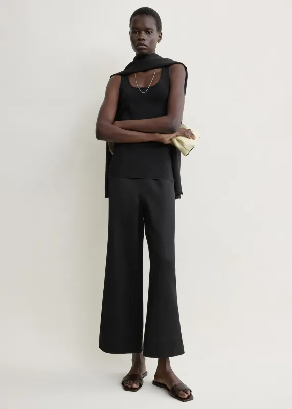 Fluid satin trousers black made by Toteme