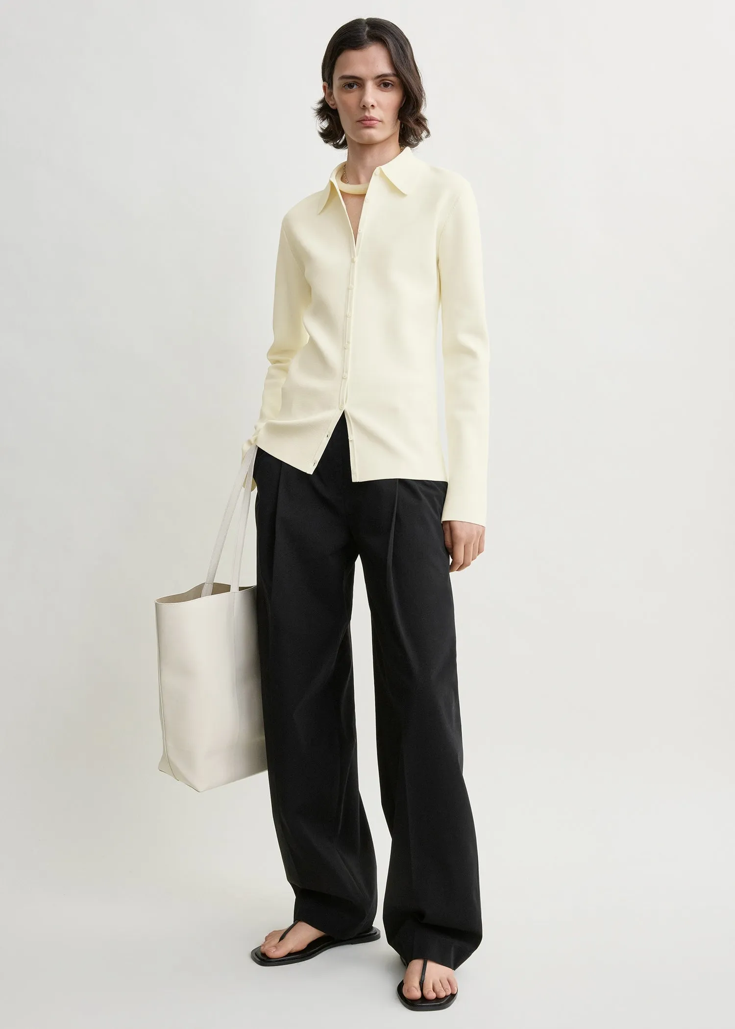 Compact knit buttoned top white sold by Toteme