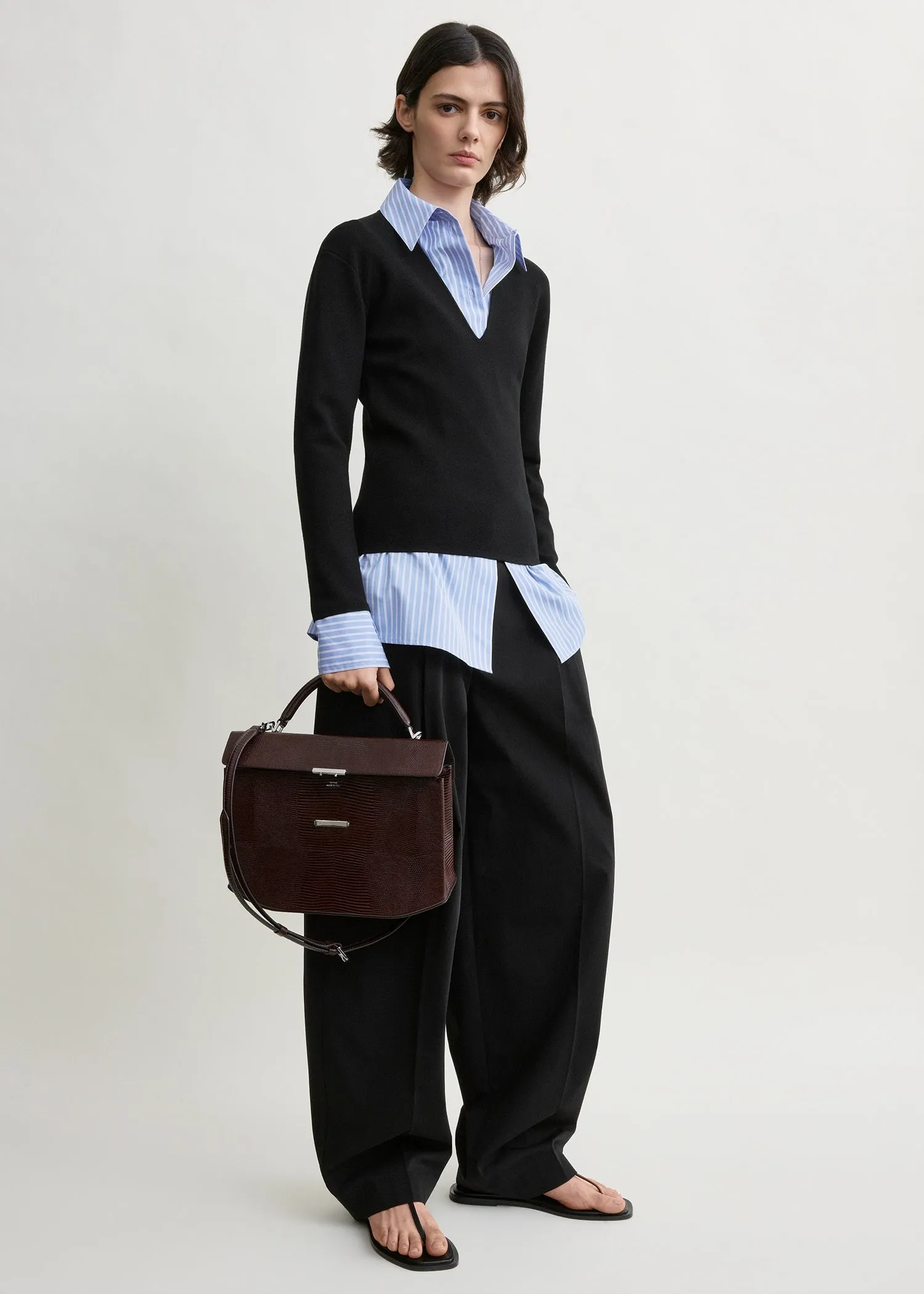 Compact knit v-neck black sold by Toteme