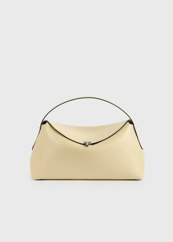 T-lock leather top handle champagne made by Toteme