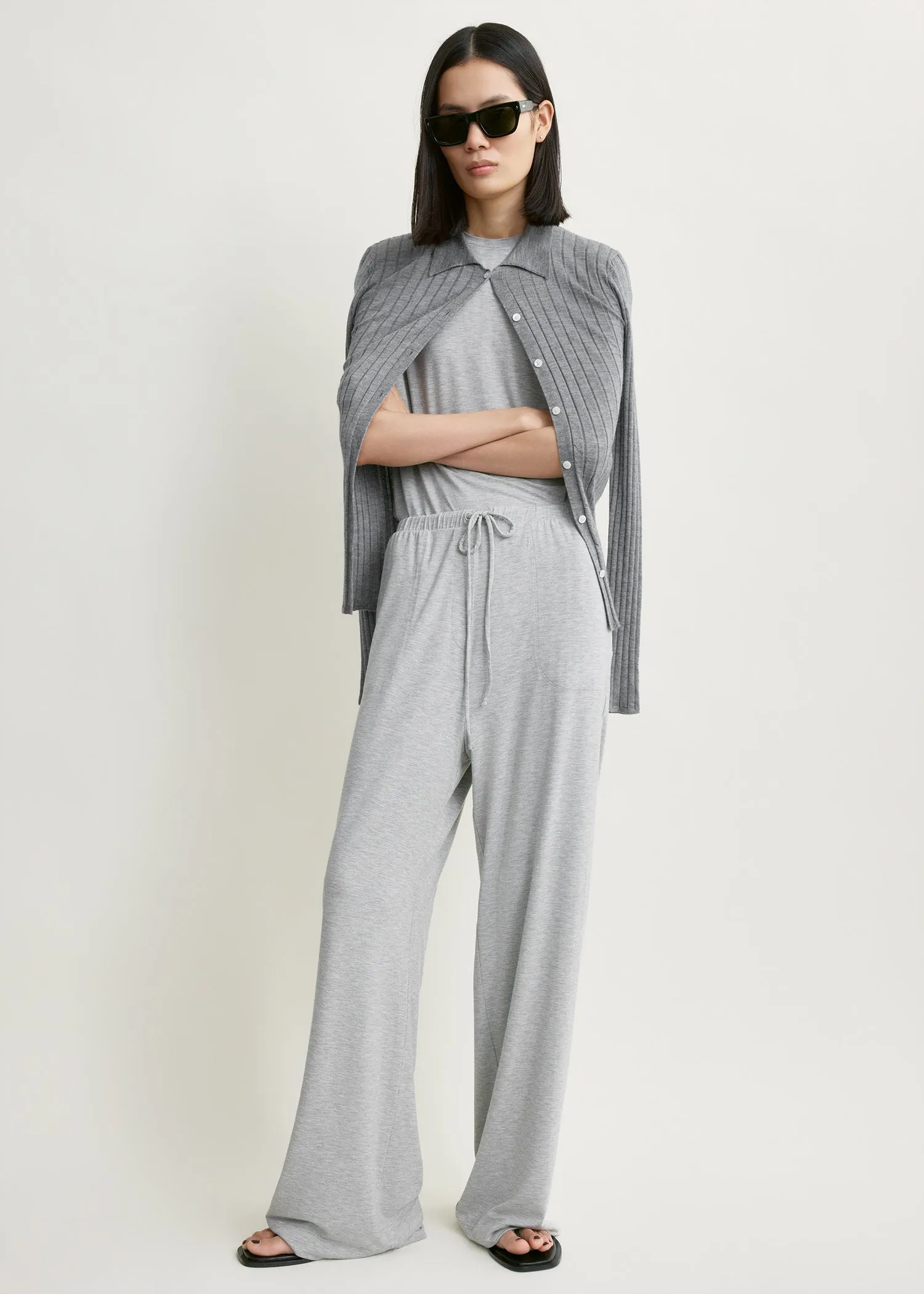 Jersey drawstring trousers pale grey mélange sold by Toteme