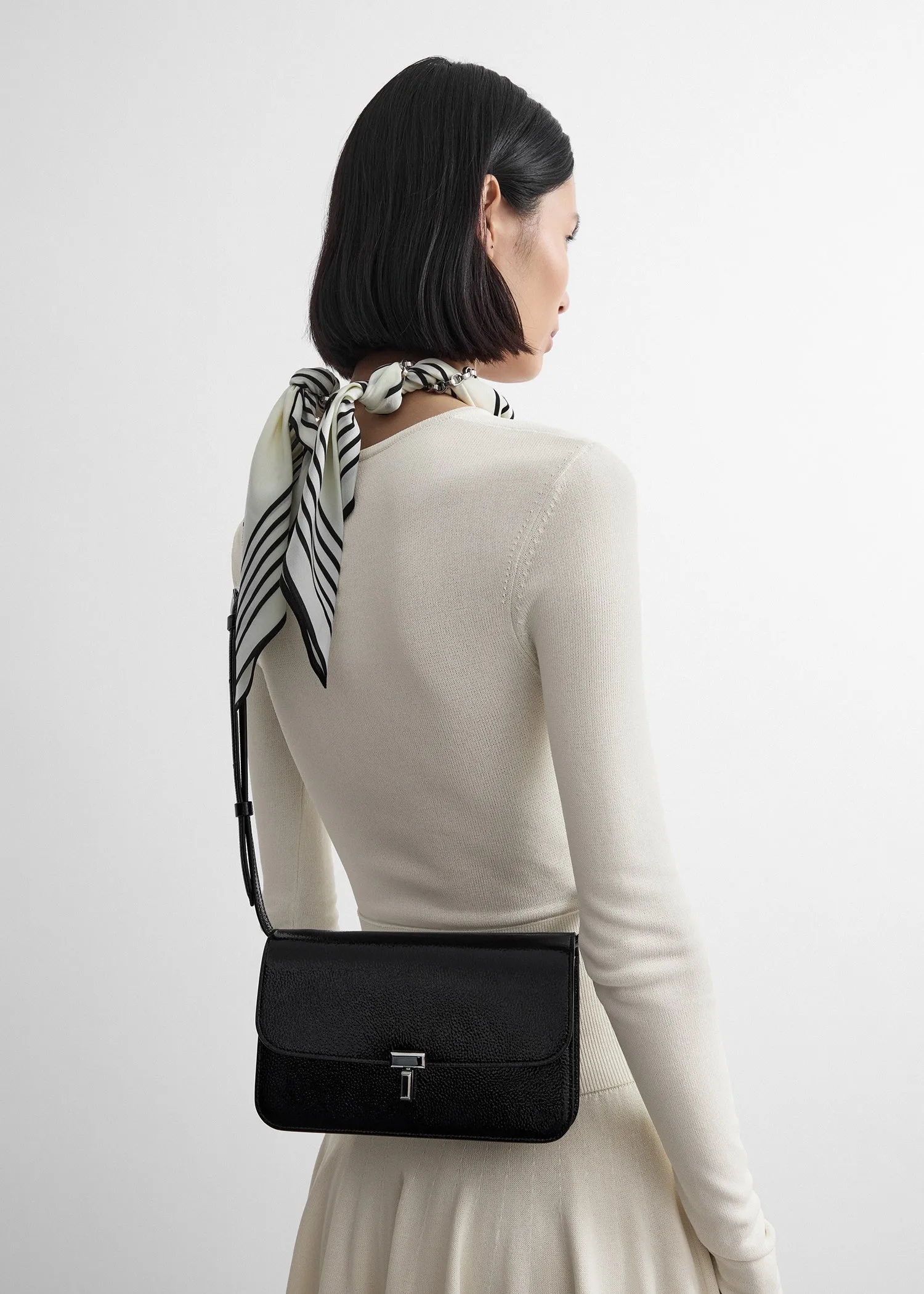 T-lock grained-patent crossbody black sold by Toteme product image thumbnail 4