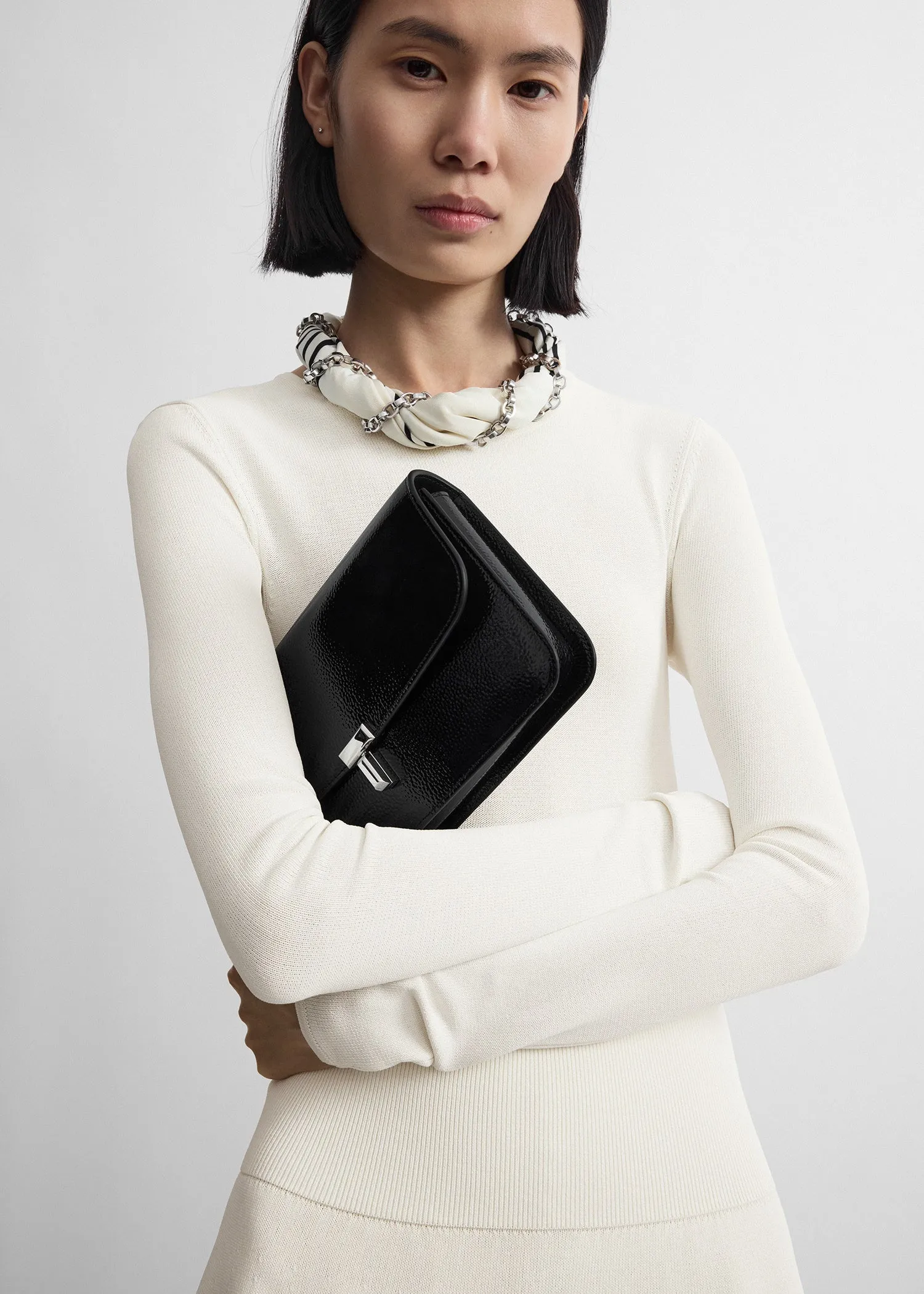 T-lock grained-patent crossbody black sold by Toteme product image thumbnail 3