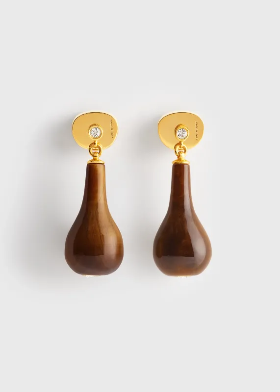 Tiger's eye drops honey/gold made by Toteme