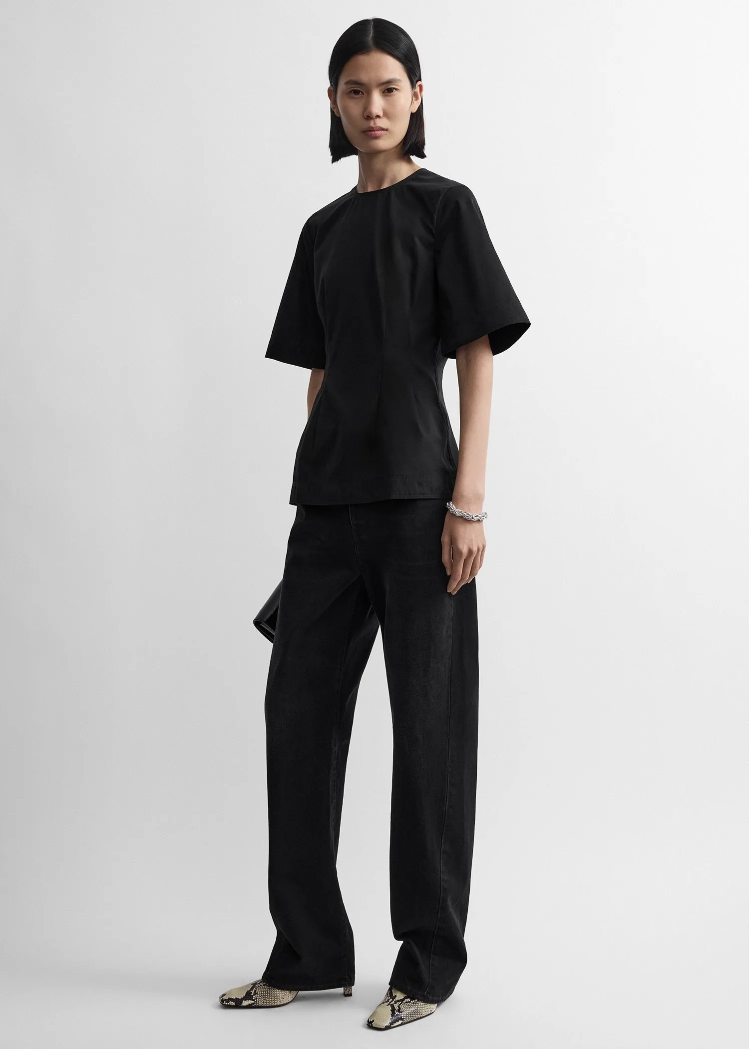 Sculptural cotton top black sold by Toteme