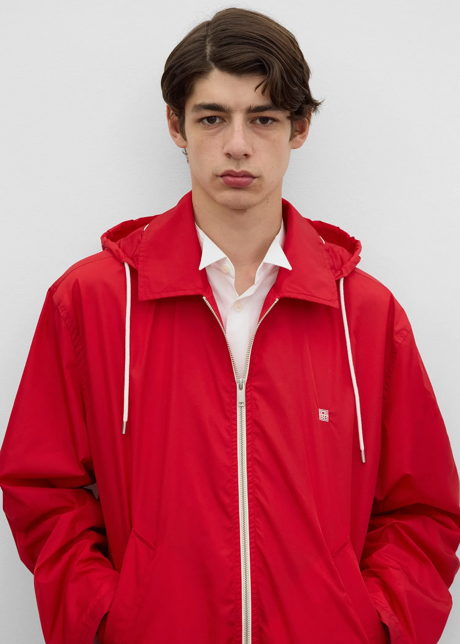 Shell jacket red sold by Toteme