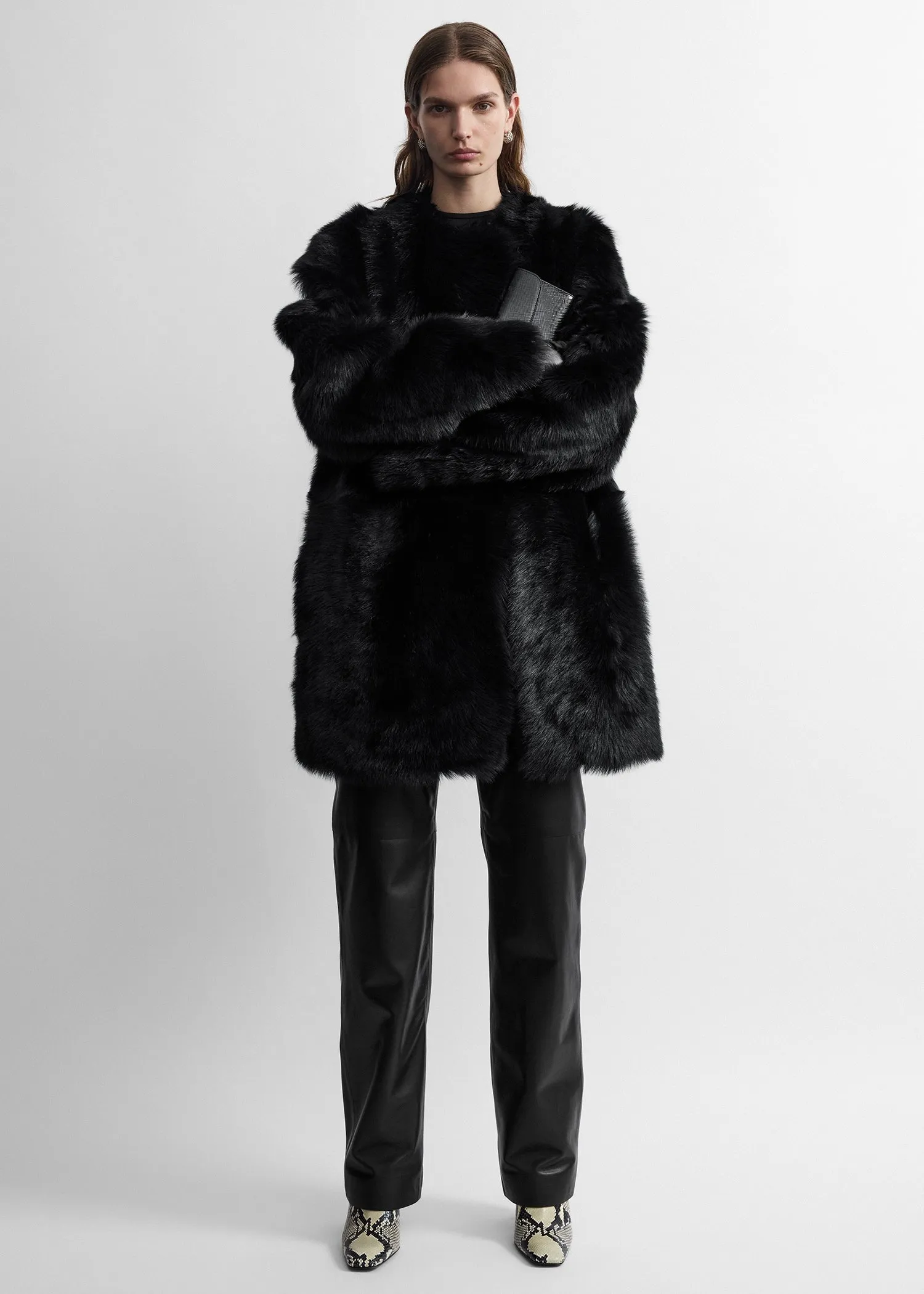 Short silky shearling coat black sold by Toteme