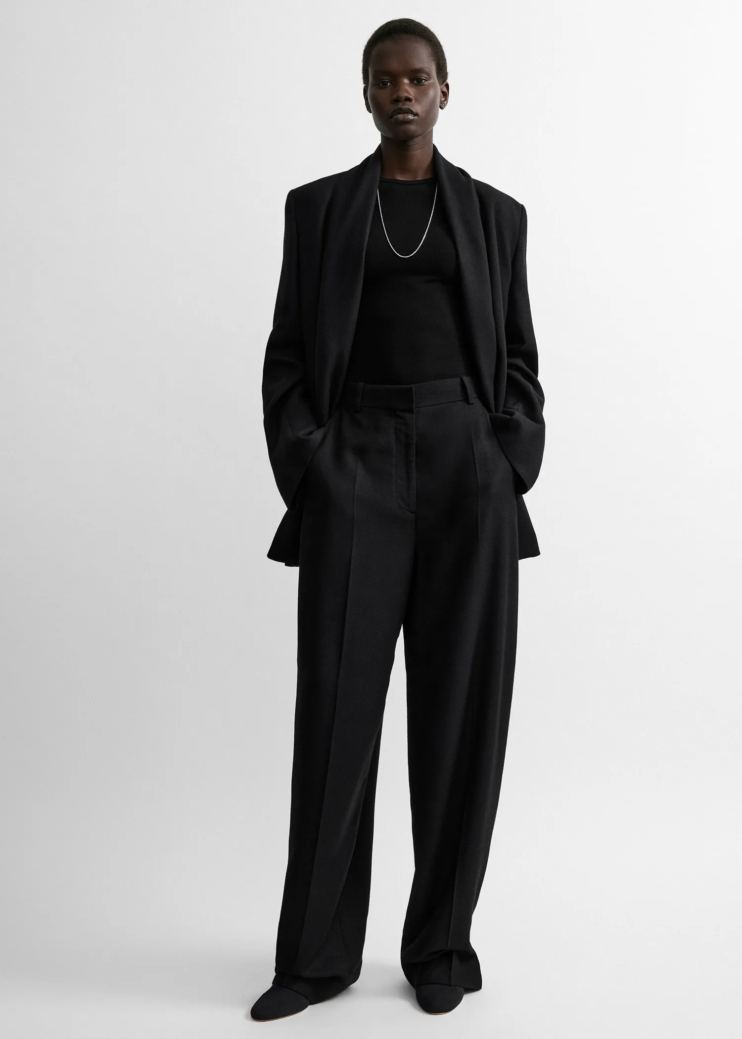 High-waist flannel trousers sold by Toteme