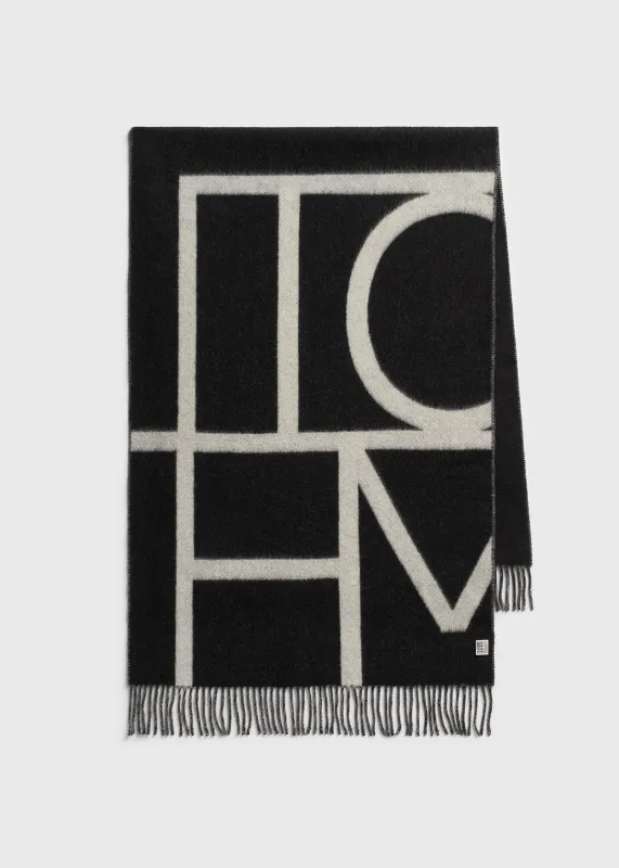 Monogram brushed wool scarf black made by Toteme