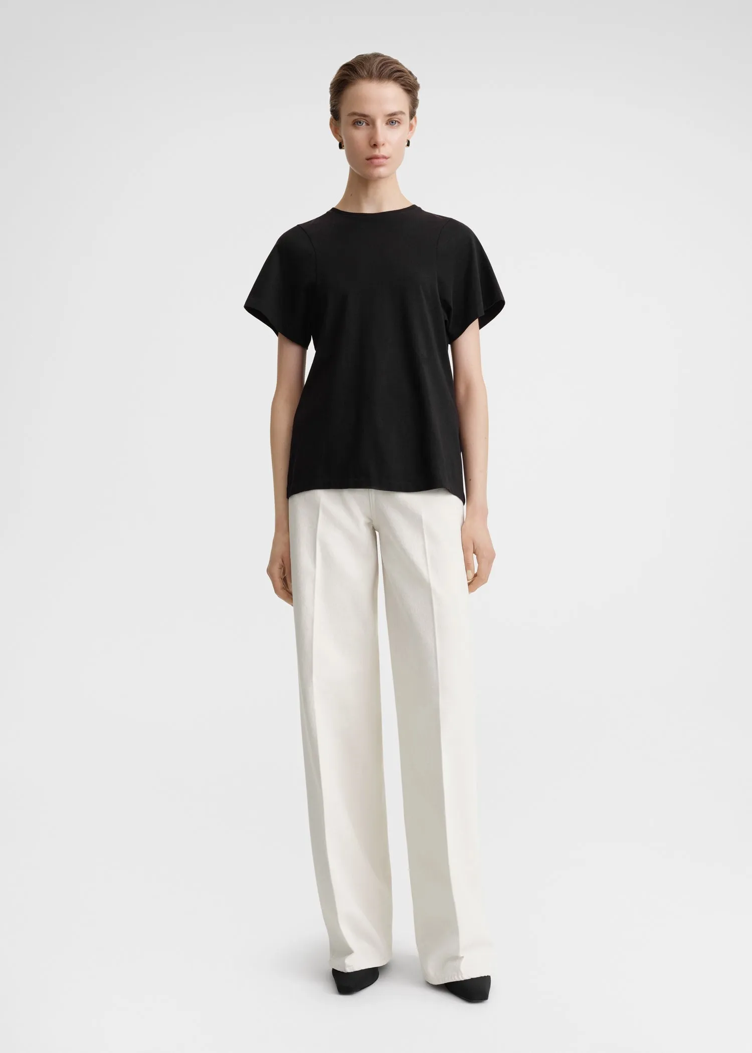 Curved seam tee black sold by Toteme