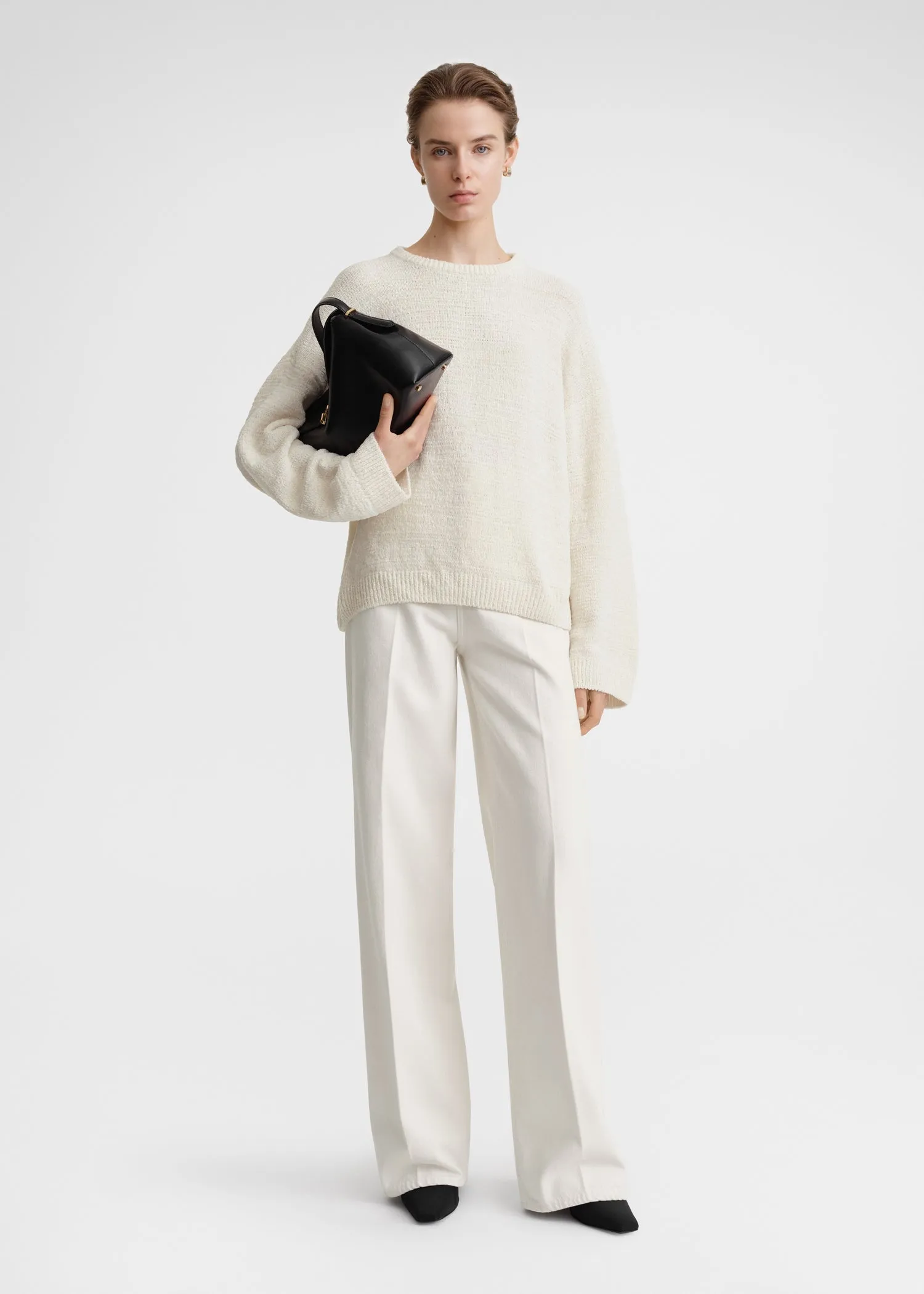 Chenille knit cream sold by Toteme