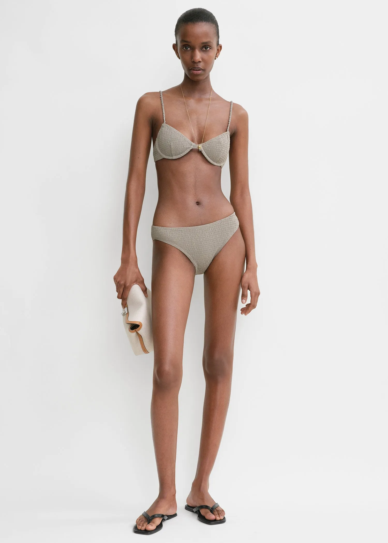 Smocked mid-rise bikini bottoms dove sold by Toteme