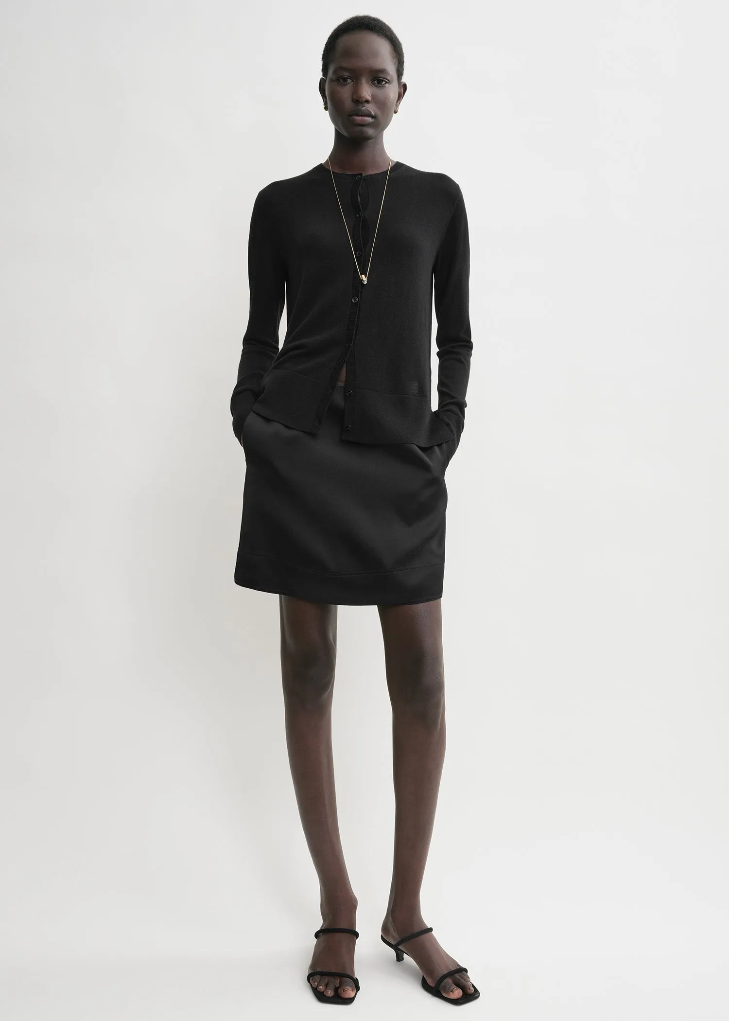 Contrast satin mini skirt black sold by Toteme