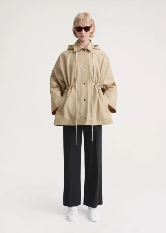 Hooded cotton-nylon parka trench beige sold by Toteme