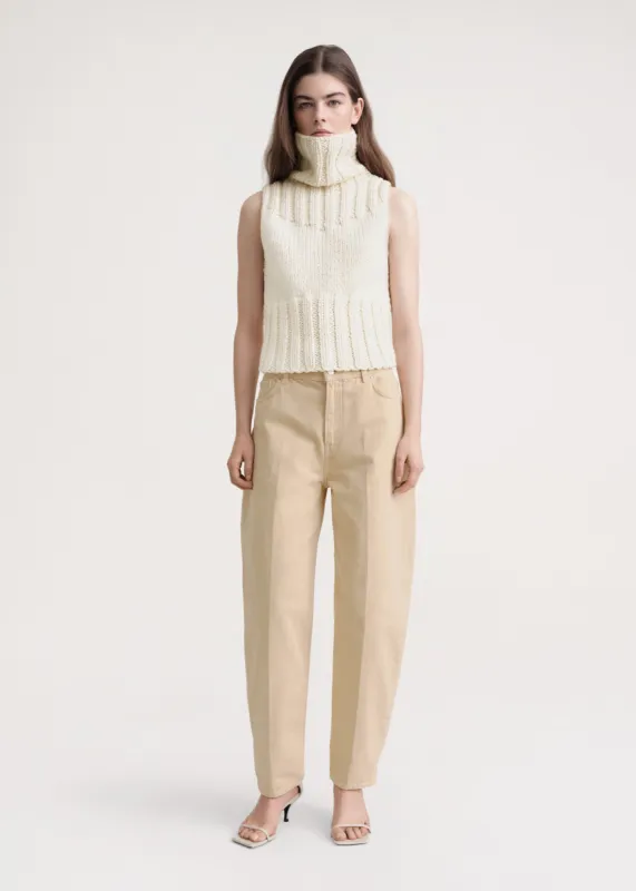 Hand-knitted wool top buttercream sold by Toteme