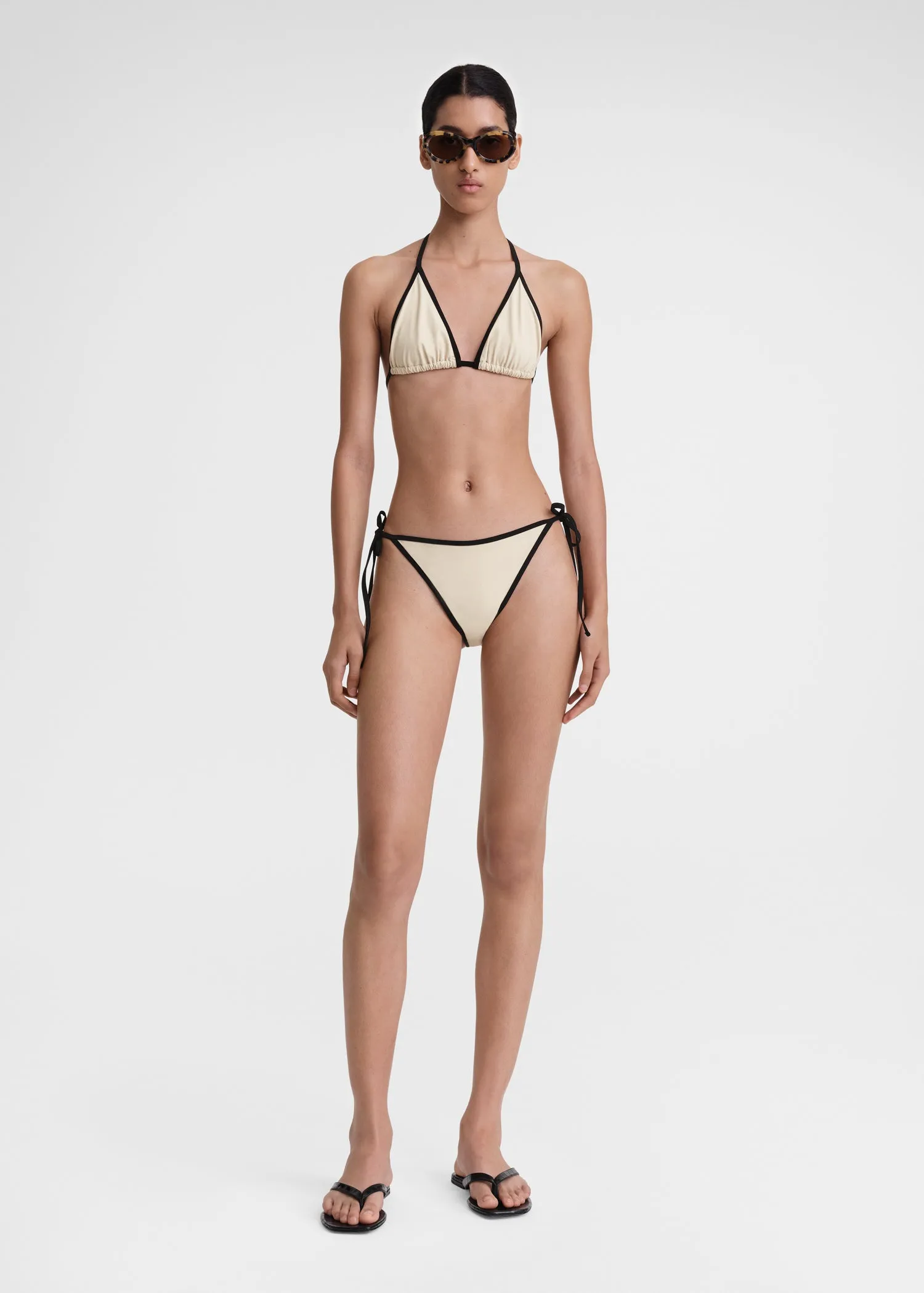 Stripe tie bikini top light hay sold by Toteme
