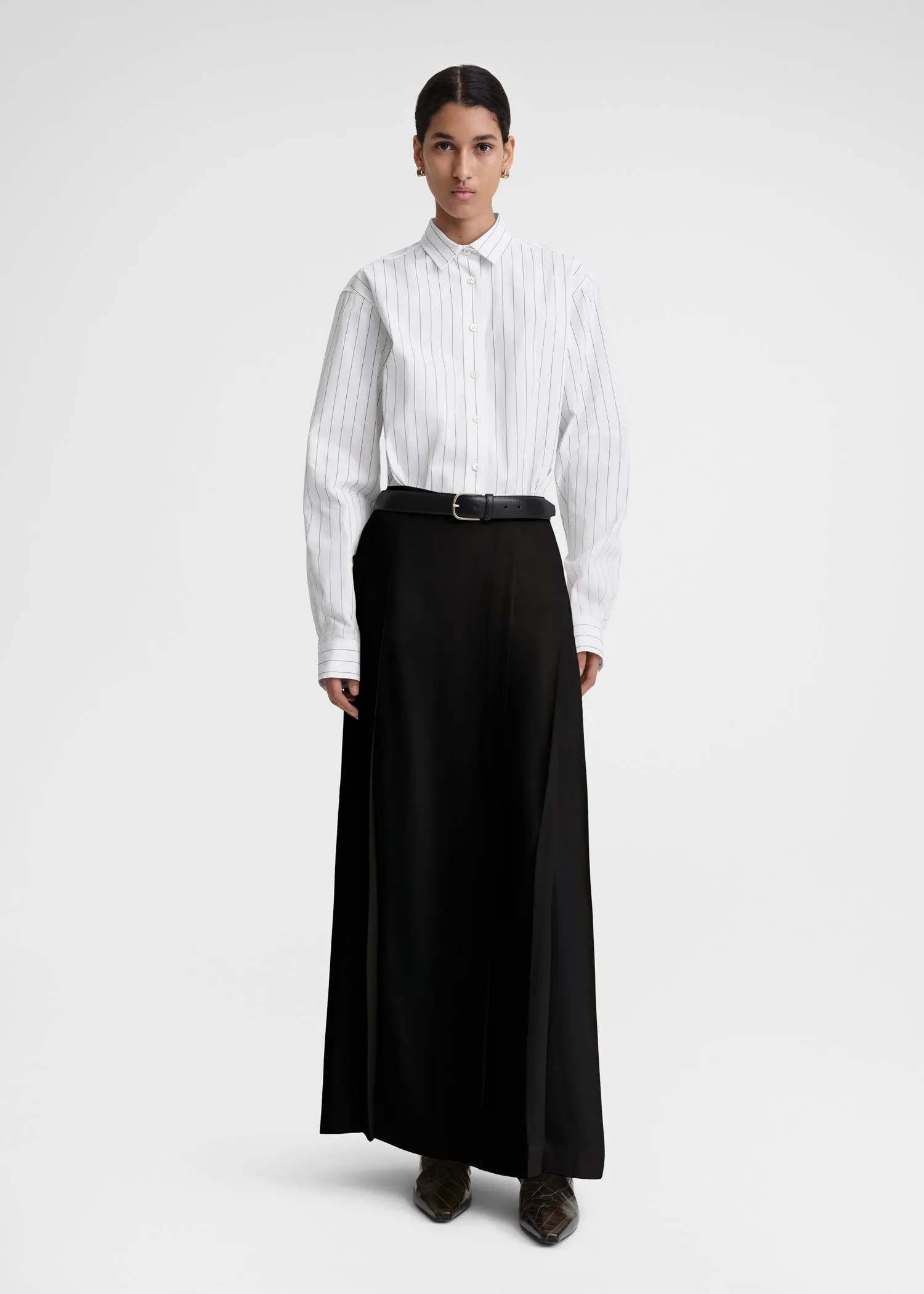 Pleated wrap skirt black sold by Toteme