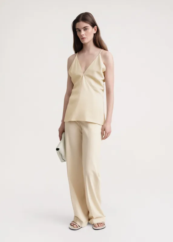 Draped twill cami top bleached sand sold by Toteme