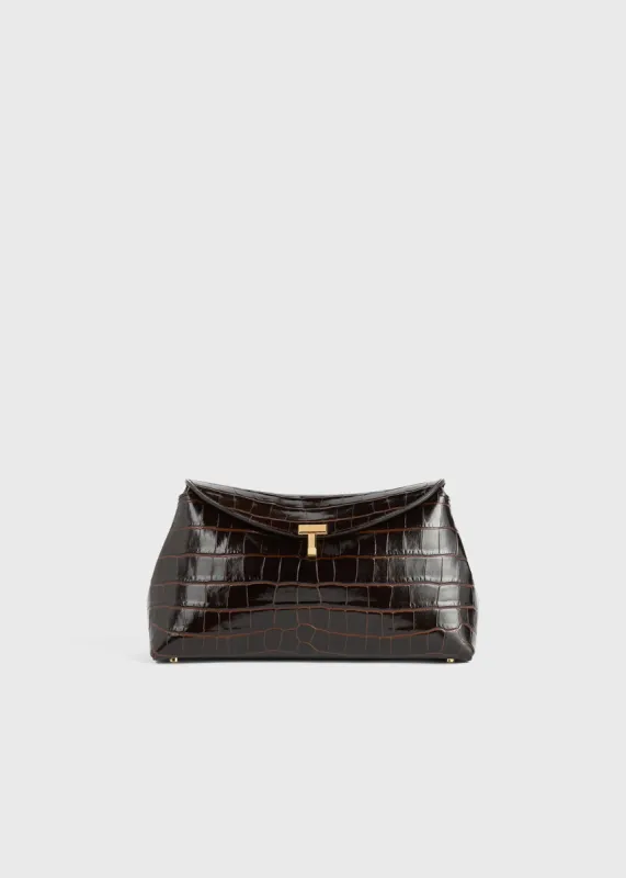 T-lock croco-embossed clutch dark brown sold by Toteme