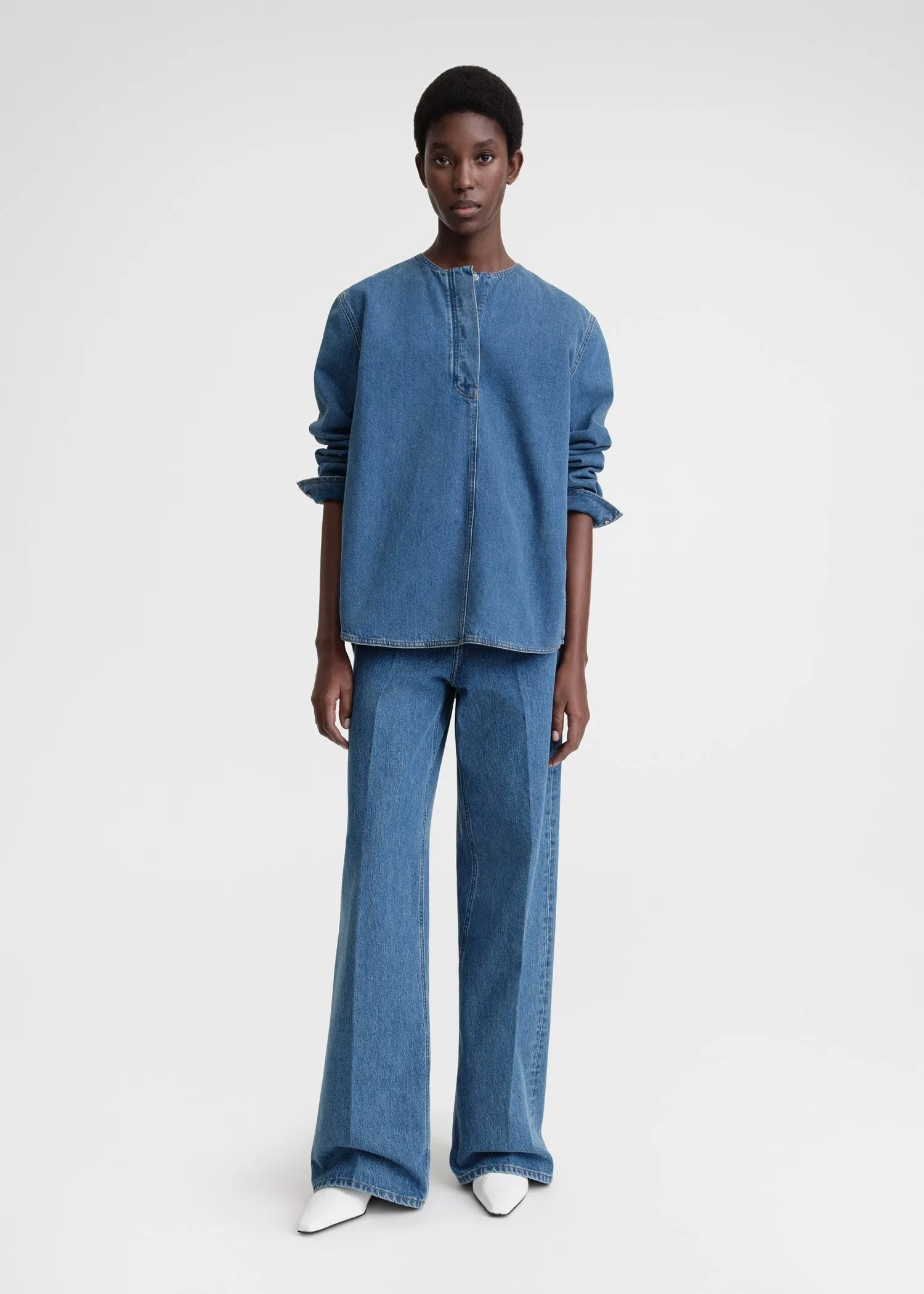 Collarless denim shirt vibrant blue sold by Toteme