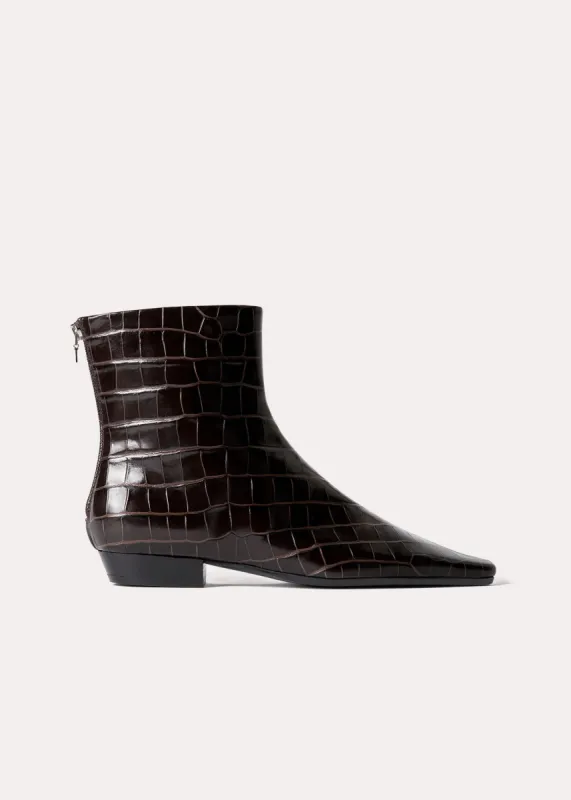 The Western Boot dark brown croco sold by Toteme